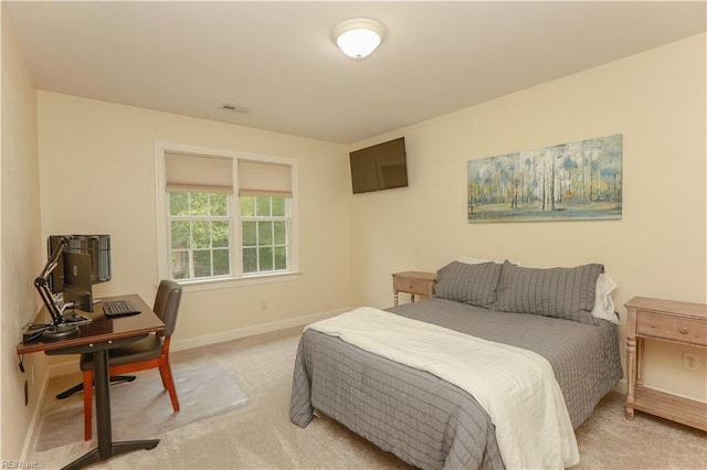 carpeted bedroom with baseboards and visible vents