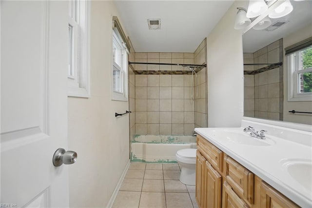 full bath with visible vents, a sink, tile patterned floors, baseboards, and toilet