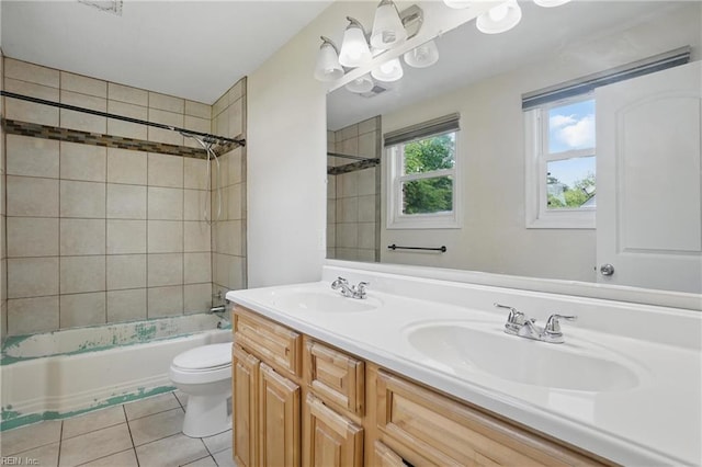 bathroom featuring a sink, double vanity, toilet, tile patterned floors, and tub / shower combination