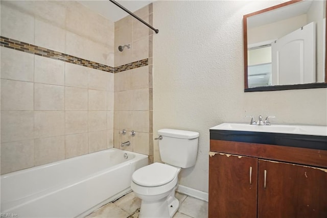 full bathroom featuring vanity, bathing tub / shower combination, toilet, baseboards, and tile patterned floors