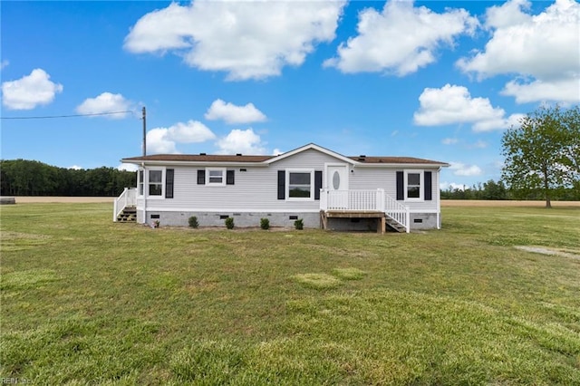 back of property with a yard and crawl space