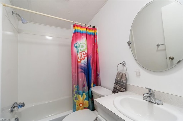 bathroom with vanity, toilet, and shower / bath combo with shower curtain
