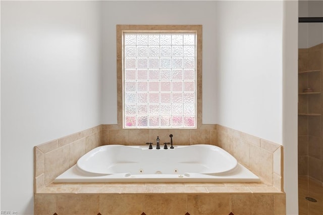 full bath with a tub with jets