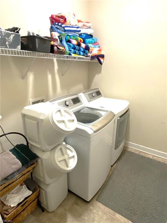 clothes washing area with laundry area and washing machine and dryer