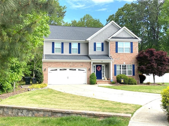 craftsman-style home with brick siding, an attached garage, driveway, and a front lawn