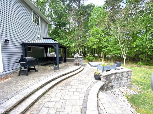 view of patio featuring a gazebo and grilling area