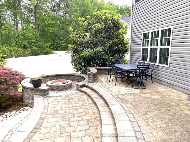 view of patio featuring a fire pit and outdoor dining space