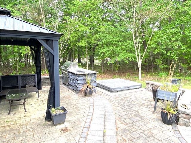 view of patio / terrace with a gazebo and area for grilling