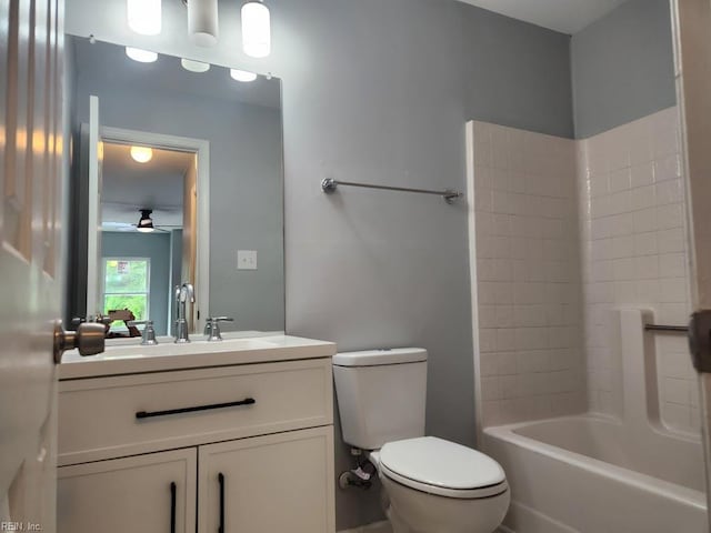 full bathroom with vanity, a ceiling fan, and toilet