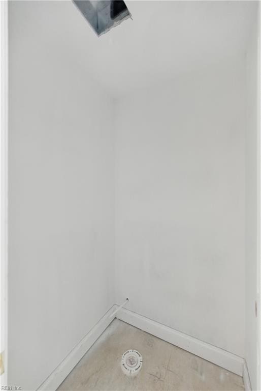 spare room with baseboards