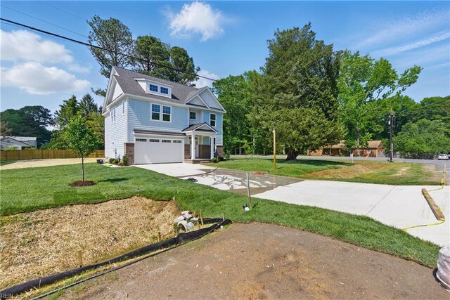 view of front of home with a garage, driveway, and stone siding