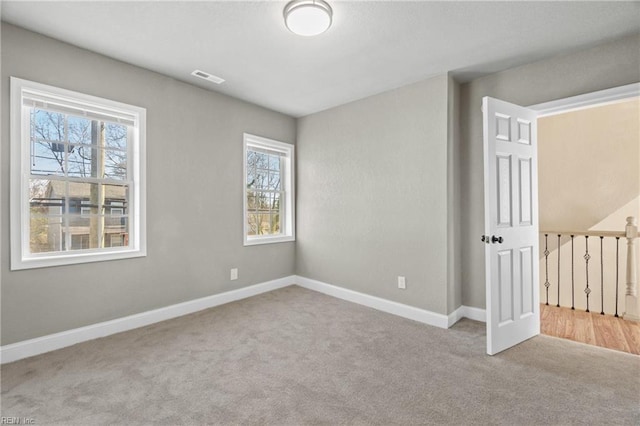 2509 Tidewater Dr, Norfolk, VA 23504 - carpeted spare room featuring baseboards