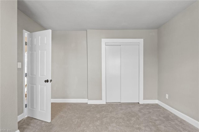 2509 Tidewater Dr, Norfolk, VA 23504 - unfurnished bedroom featuring carpet, a closet, and baseboards