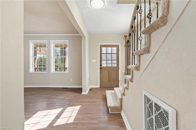 2509 Tidewater Dr, Norfolk, VA 23504 - entryway with wood finished floors, healthy amount of natural light, baseboards, ornamental molding, and stairs