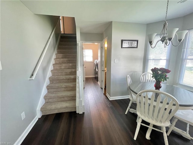 1304 Fernham Ln, Chesapeake, VA 23322 - dining room featuring independent washer and dryer, baseboards, a notable chandelier, stairs, and dark wood-type flooring