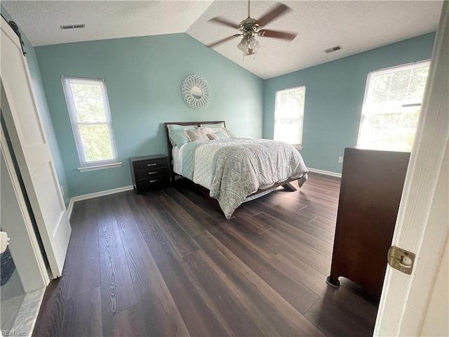 1304 Fernham Ln, Chesapeake, VA 23322 - bedroom with visible vents, lofted ceiling, baseboards, dark wood-type flooring, and a textured ceiling