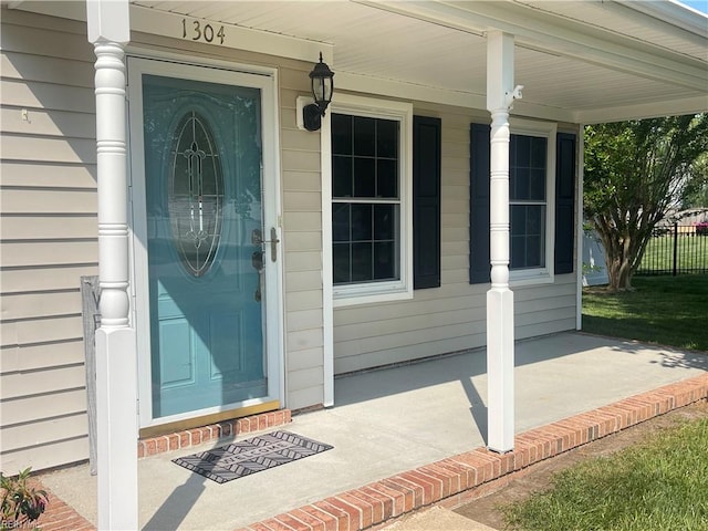 1304 Fernham Ln, Chesapeake, VA 23322 - entrance to property with a porch and fence
