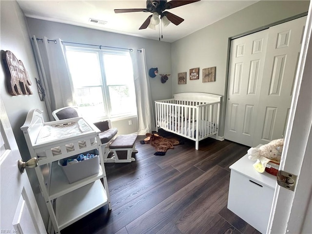 1304 Fernham Ln, Chesapeake, VA 23322 - bedroom featuring ceiling fan, visible vents, a nursery area, a closet, and dark wood-type flooring