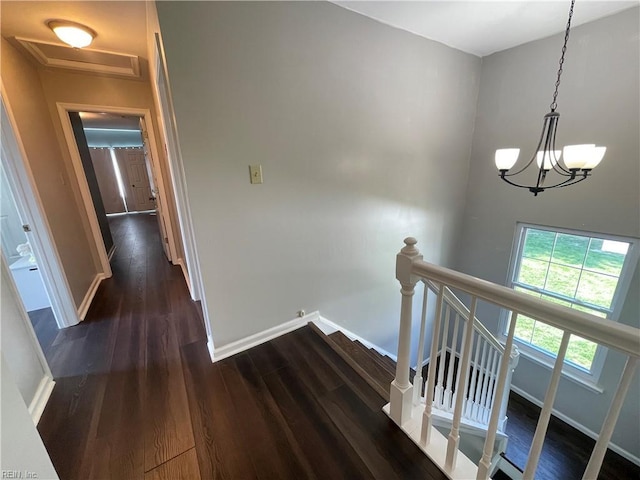 1304 Fernham Ln, Chesapeake, VA 23322 - hall featuring an inviting chandelier, dark wood finished floors, baseboards, and an upstairs landing