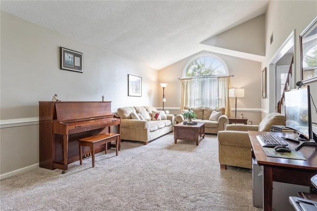 living area with plenty of natural light, a textured ceiling, carpet, and lofted ceiling
