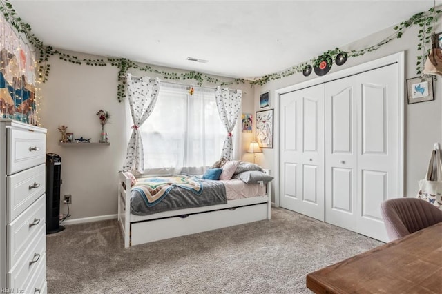 bedroom with a closet, carpet flooring, and visible vents