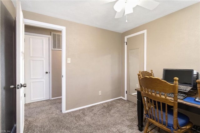 office space with carpet floors, baseboards, a ceiling fan, and visible vents