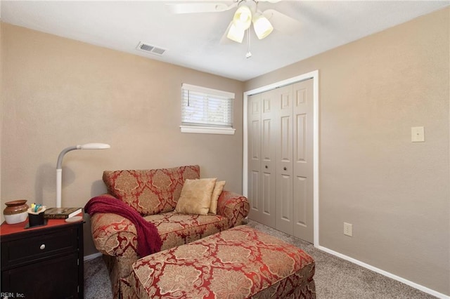 carpeted bedroom with a ceiling fan, baseboards, visible vents, and a closet