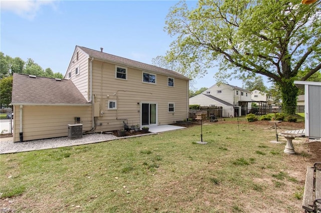 back of property with a fenced backyard, a patio, a lawn, and central AC unit