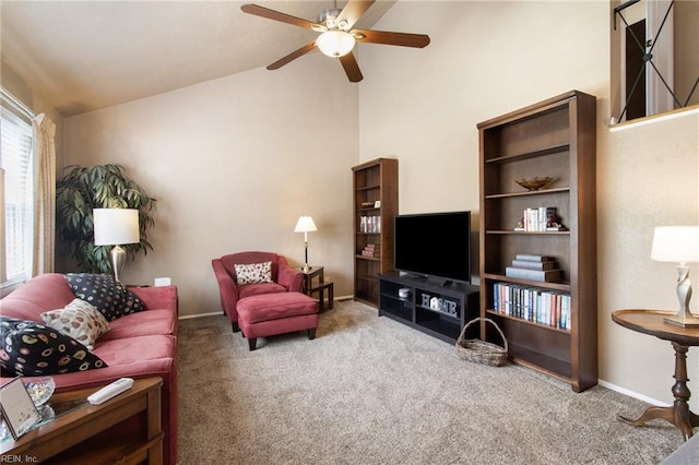 carpeted living room featuring a ceiling fan, baseboards, and high vaulted ceiling