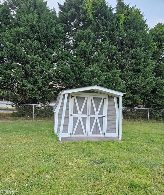 view of shed with fence