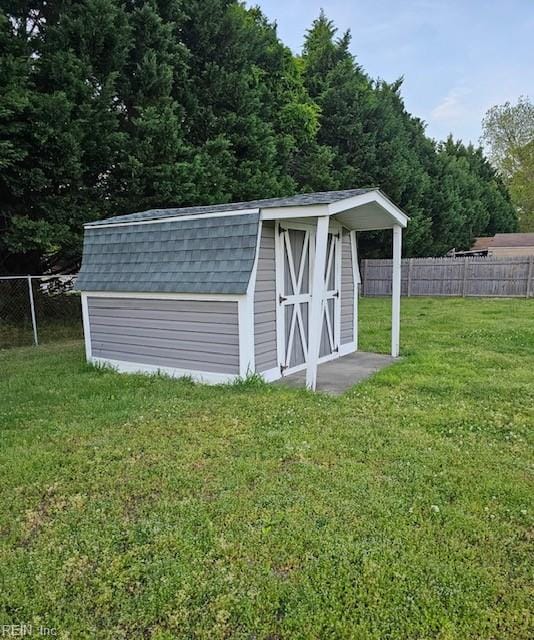 view of shed with a fenced backyard