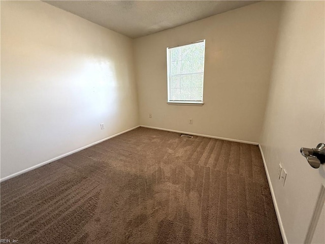 3703 Sylvan Ln, Virginia Beach, VA 23453 - spare room featuring dark carpet, baseboards, and a textured ceiling