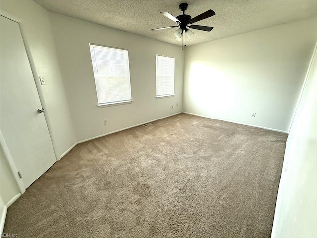 3703 Sylvan Ln, Virginia Beach, VA 23453 - unfurnished room featuring carpet floors, a textured ceiling, a ceiling fan, and baseboards