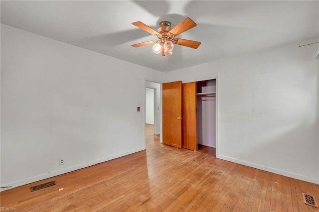 unfurnished bedroom with light wood-style floors, baseboards, and visible vents