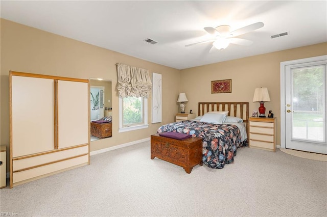 bedroom with visible vents, carpet, and multiple windows