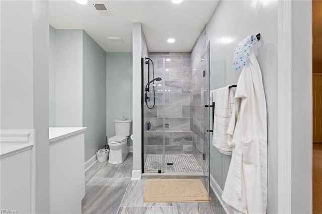 full bathroom featuring recessed lighting, baseboards, a stall shower, and toilet