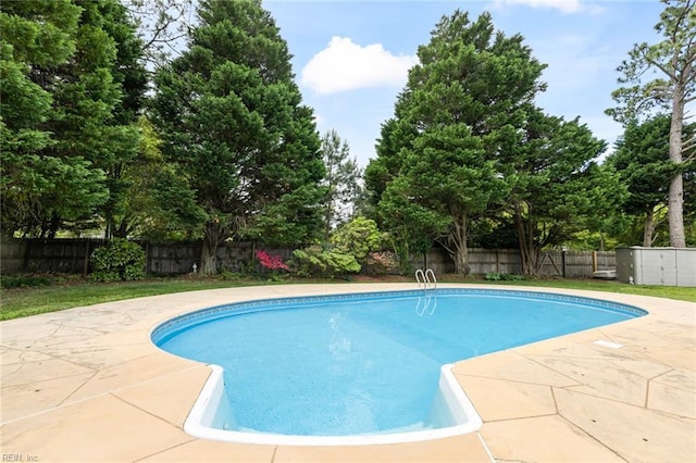 view of swimming pool with a patio, a fenced in pool, and a fenced backyard