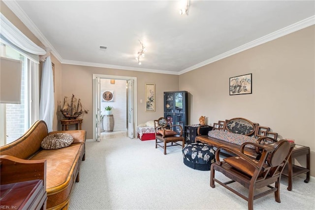 living area featuring ornamental molding, carpet, rail lighting, and visible vents