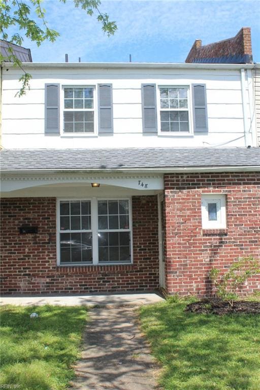 traditional-style house with brick siding