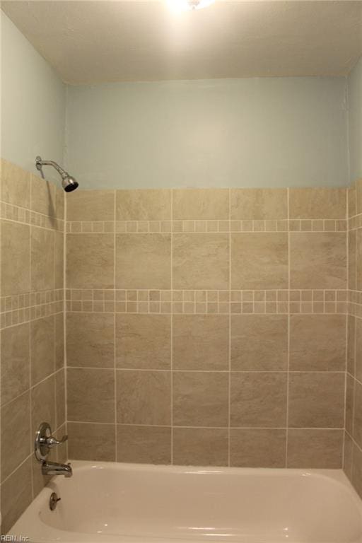 full bath featuring bathing tub / shower combination