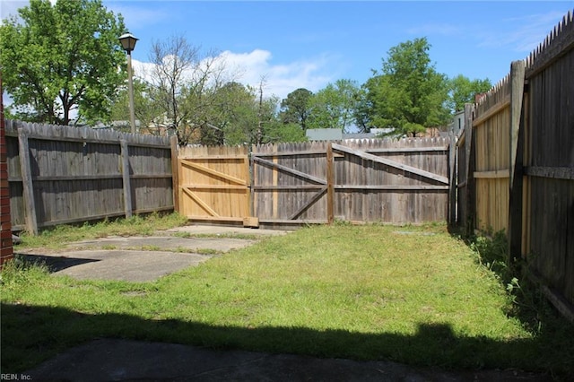 view of yard with a fenced backyard