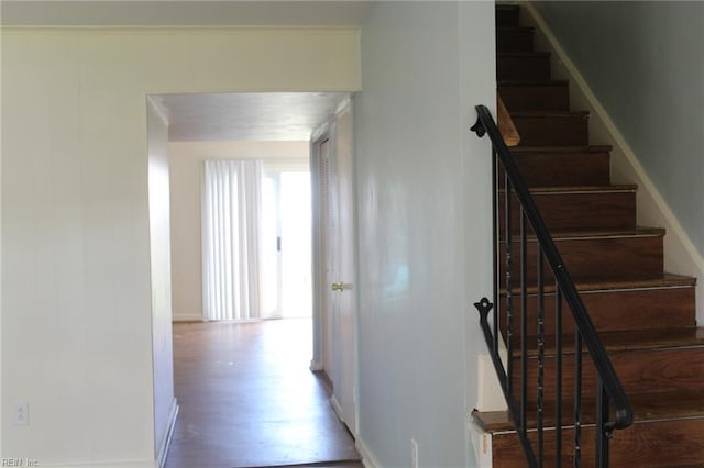 stairs featuring baseboards and wood finished floors