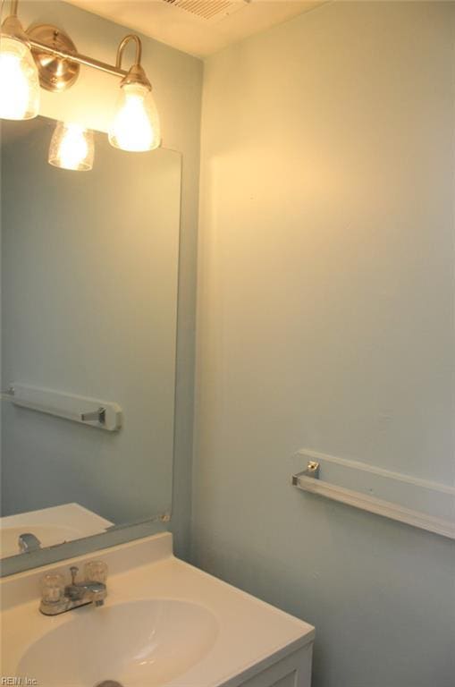 bathroom featuring visible vents and vanity