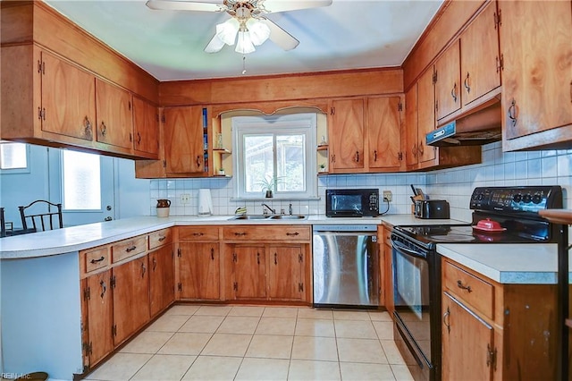 kitchen with ceiling fan, a sink, light countertops, black appliances, and under cabinet range hood