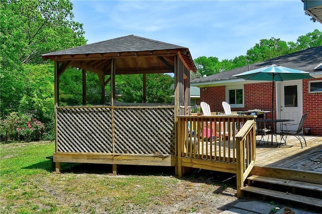 deck with a gazebo and outdoor dining area