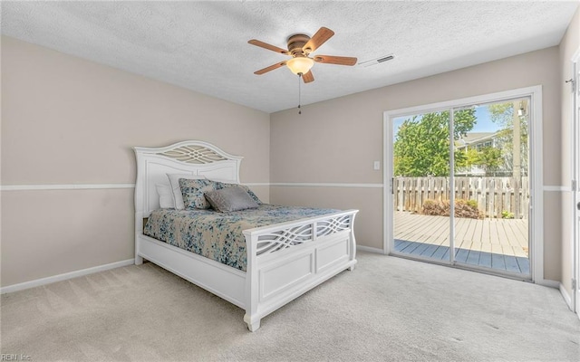 bedroom featuring baseboards, visible vents, light colored carpet, and access to exterior