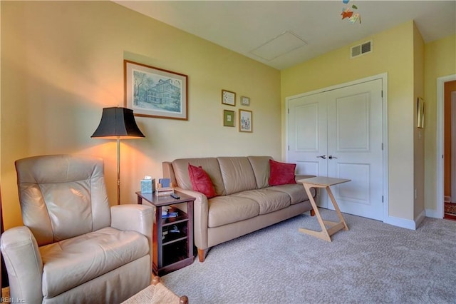 carpeted living area featuring baseboards