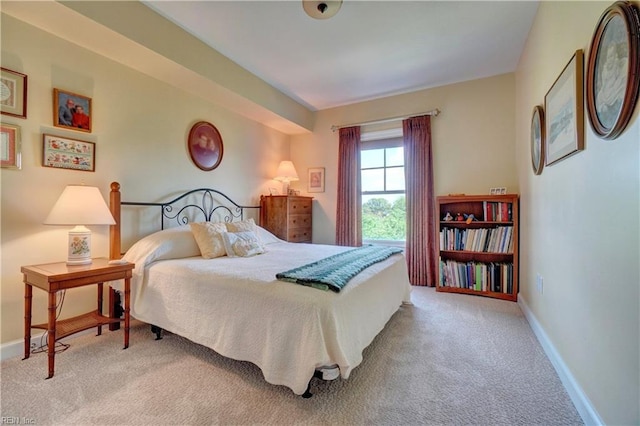 bedroom with carpet flooring and baseboards