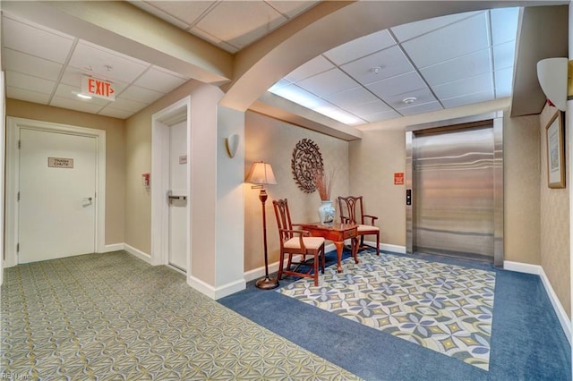 common area featuring a drop ceiling