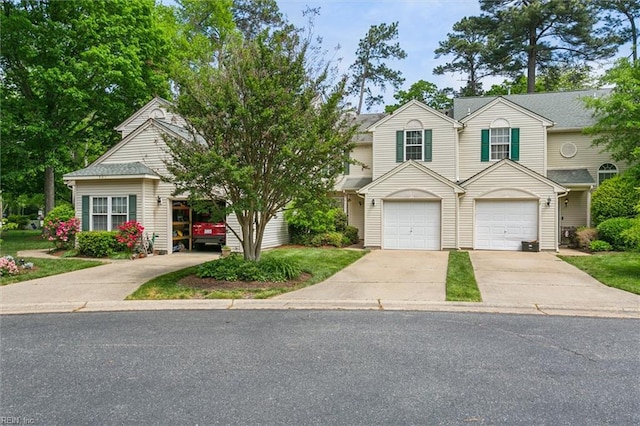 view of front of property with concrete driveway